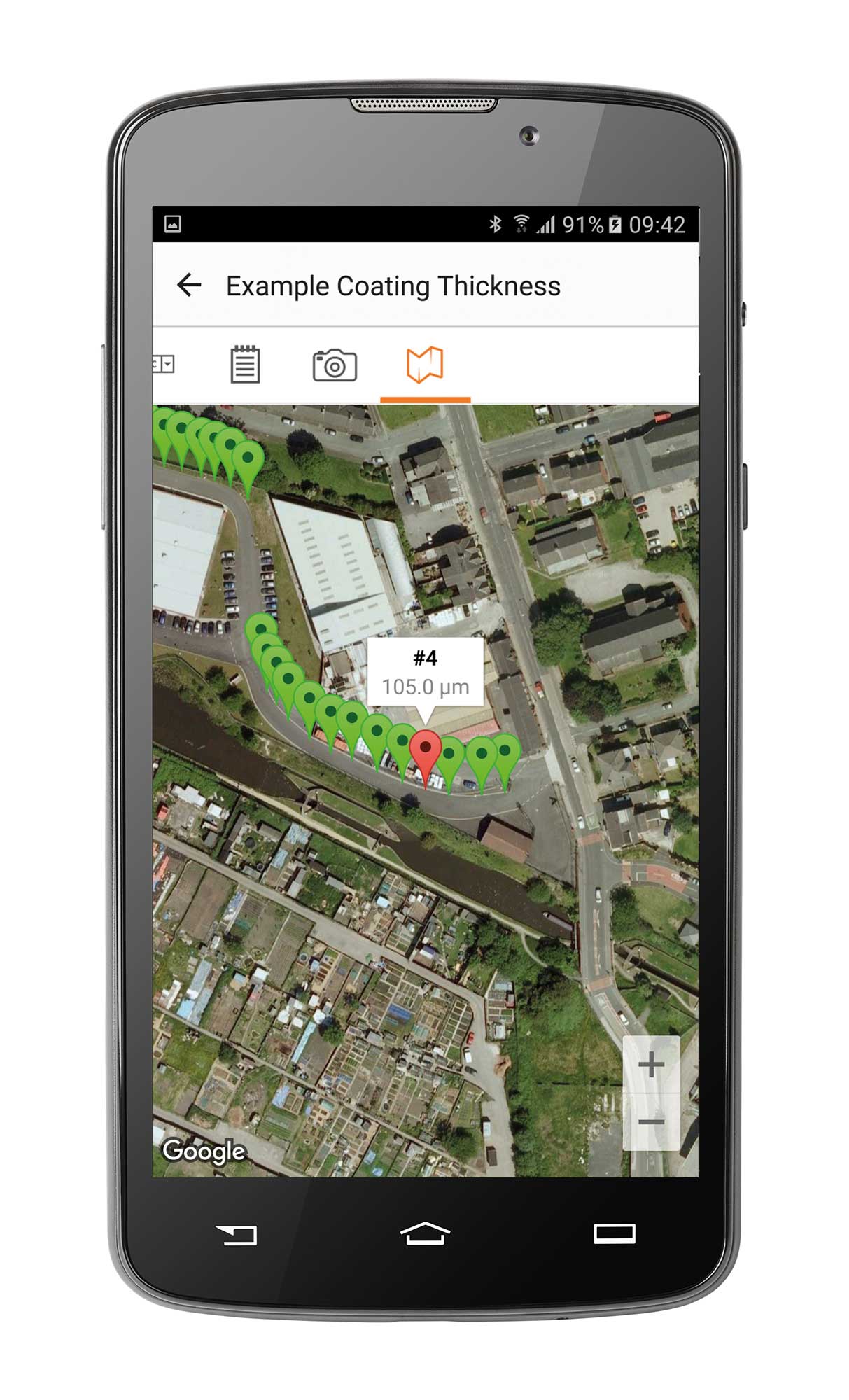 Dark mobile phone with a map on the screen and pinpoints to show the location.